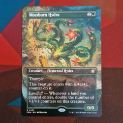 Wizards of the Coast MTG Mossborn Hydra 337 Foundations Rare Regular Green EN - Image 1