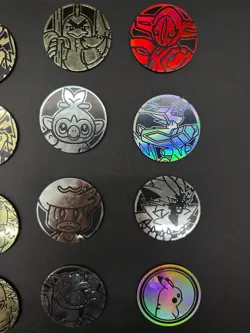 Lot of 29 Official Pokemon TCG Coins Jumbo & Small W/ Two Trading Card Game Book - Image 2