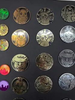Lot of 29 Official Pokemon TCG Coins Jumbo & Small W/ Two Trading Card Game Book - Image 3