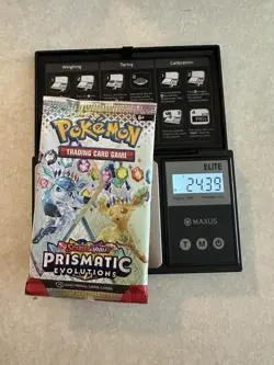 Pokemon Prismatic Evolutions Booster Pack -HEAVY 24.39g- Possible Demi/God Pack! - Image 1