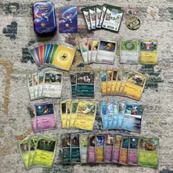 Pokemon tin gift bundle - 50 Pokemon PAR Paradox Rift TCG cards & accessories - Image 1