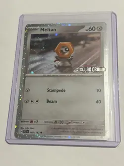 Pokemon TCG Meltan 102/142 – Stellar Crown Cosmos Holo Stamped – NM - Image 1