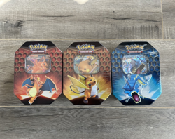 Pokemon TCG Hidden Fates Tins Art Set of 3 - Charizard Gyarados & Raichu SEALED - Image 1