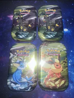 Pokemon TCG Prismatic Evolutions Mini Tins Assorted Lot of 4 - Image 1