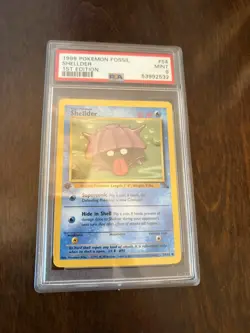 1999 POKEMON FOSSIL 1ST EDITION #54 - SHELLDER PSA 9 MINT - Image 1