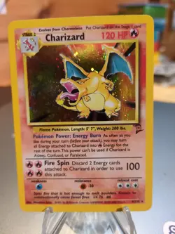 Charizard 004/130 Base Set 2 Holo SWIRL Rare Pokemon Card - Image 1
