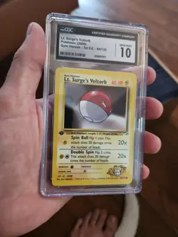 (POP 23) CGC 10 GEM MINT Lt. Surge's Voltorb 84/132 1st Edition Pokemon Card - Image 1
