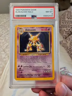 1999 Pokemon Alakazam 1/102 Base Set Holo PSA 8 NM-MT WOTC Vintage - Image 1