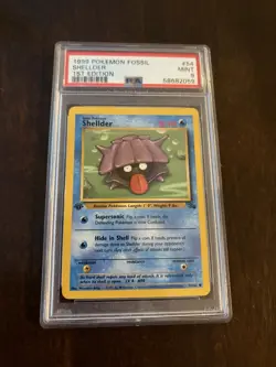 1999 POKEMON FOSSIL 1ST EDITION #54 - SHELLDER PSA 9 MINT - Image 1
