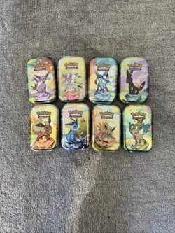 Prismatic Evolutions *EMPTY* Mini Tin Complete Set Of 8 (Tin + Card + Coin) - Image 1