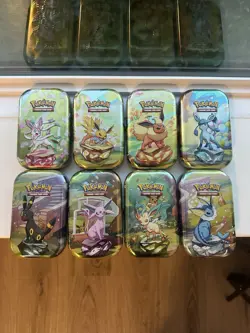 Prismatic Evolutions *EMPTY* Mini Tin Complete Set Of 8 (Tin + Card + Coin) - Image 1