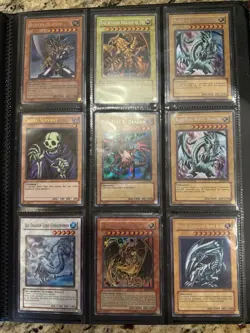 Yu-Gi-Oh! Cards With Binder - Blue-Eyes Red-Eyes Buster Blader Dragon of Ra - Image 1