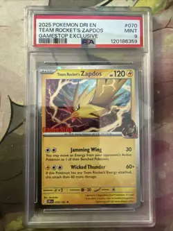 2025 POKEMON DESTINED RIVALS GAMESTOP EXCLUSIVE #070 TEAM ROCKET'S ZAPDOS PSA 9 - Image 1