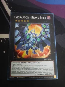 YuGiOh Raidraptor - Brave Strix PHNI-EN046 Super Rare 1st Edition - Image 1
