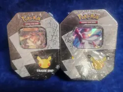Pokemon 25th Anniversary Celebrations Tin Set: Lance's Charizard & Dark Sylveon - Image 1