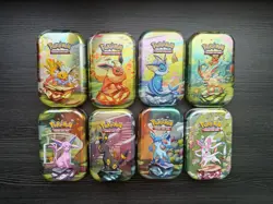 BRAND NEW Pokemon Prismatic Evolutions | Empty Mini Tins With Coins And Art Card - Image 1