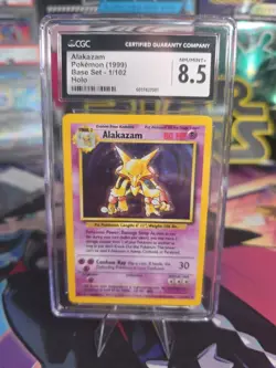 Pokemon TCG Alakazam Base Set Holo Card 1/102 GRADED CGC 8.5 NM-MINT 1999 - Image 1