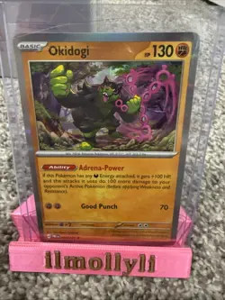 Pokemon TCG Okidogi Prismatic Evolutions Master Ball Pattern Holo Card 057/131 - Image 1