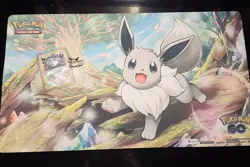 Radiant Eevee Pokemon GO Promo Card (SWSH230) with Enamel Pin and Playmat - Image 1