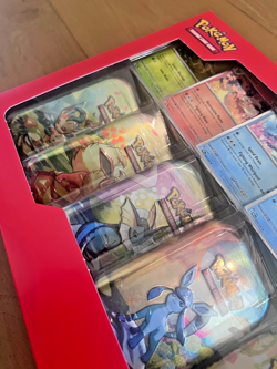 Pokemon TCG Prismatic Evolutions Costco Exclusive Mini Tins 8 Pack w Promos NEW - Image 2