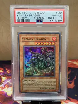 Yugioh PSA 8 Near Mint-Mint Yamata Dragon LOD-067 Ultra Rare 1st Edition Holo - Image 1