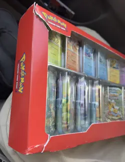 Pokemon Prismatic Evolutions 8 Mini Tins Costco SEALED *Damaged Box* - Image 1