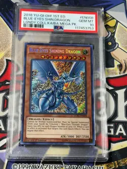 Yugioh PSA 10 Blue-Eyes Shining Dragon LCKC-EN008 Secret Rare 1st Edition - Image 1