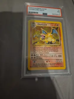PSA 7 Charizard 4/102 Base Set Rare Holo Pokemon Card 1999 WOTC - Near Mint - Image 1