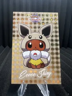 Shiny Eevee Poncho - Gold Box Hit Holo - Let's Go Eevee Database - Pokemon Card - Image 1