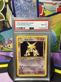 Pokemon TCG Alakazam Base Set Holo Card 1/102 PSA 8 - Image 1