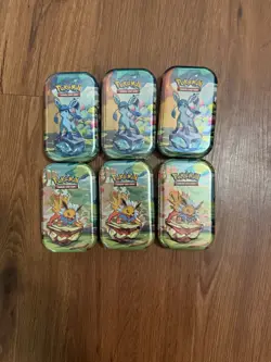Pokemon TCG Scarlet and Violet Prismatic Evolutions Mini Tins Set of 6 Unopened - Image 1