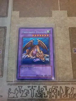 YUGIOH THOUSAND DRAGON MRD-143 SECRET UNLIMITED ED MP BLEED EFFECT 1996 - Image 1