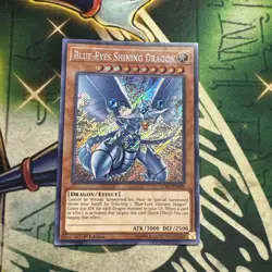 Yugioh! Blue-Eyes Shining Dragon LCKC-EN008 Secret Rare 1st Edition NM/M - Image 1