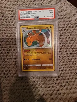 2019 Pokemon Sun & Moon Team Up Cosmos Dragonite Holo #119 PSA 7 - Image 1