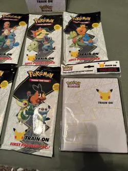 Pokemon 25th Anniversary First Partner Pack Lot of 5 - INCLUDES DISPLAY & BINDER - Image 3