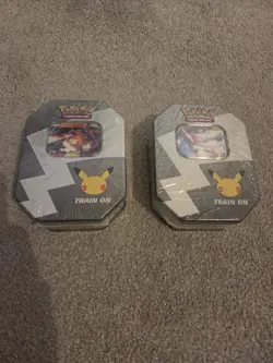 Sealed Set Of Two Pokemon TCG Celebrations 25th Anniversary Tins. - Image 1