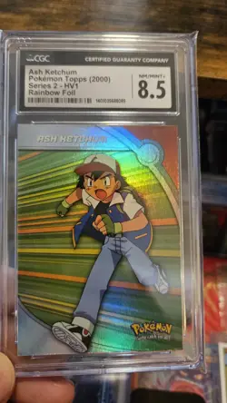 Ash Ketchum Pokemon Topps (2000) Series 2 - HV1 Rainbow Foil CGC 8.5 - Image 1