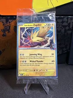 Team Rocket’s Zapdos Gamestop Promo Stamp Sealed Pokemon Card - Image 1