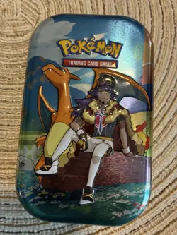 Pokemon Crown Zenith Mini Tin Leon Charizard, Comes With Sticker And Art Card. - Image 1