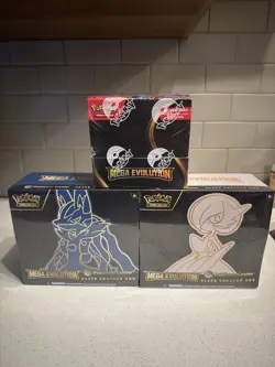Pokemon TCG Mega Evolutions Enhanced Booster Box PKMN Center + 2 PC ETB in hand - Image 1