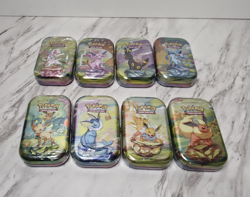 Pokemon TCG Prismatic Evolutions Mini Tin Complete Set - 8 Factory Sealed Tins - Image 1