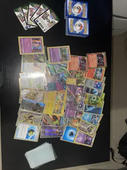 Pokemon Cards with 35 Sleeved Cards, 32 Sleeves, 5 Codes, And Lots Of Bulk. - Image 1