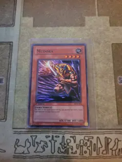 YUGIOH MUDORA DCR-076 SUPER 1ST ED LP 1996 - Image 1