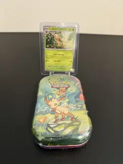 Pokemon Costco Prismatic Evolutions TCG Mini Tin Sealed + Leafeon Foil Card - Image 1