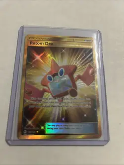 Pokemon TCG Rotom Dex 159/149 Sun & Moon Gold Secret Rare - Image 1