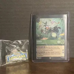 Disney Lorcana Goofy Emerald Champion Promo Card & Lorcana Pin - Image 1