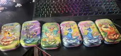 Tin cases of Pokemon cards - Image 1