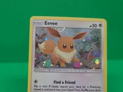 Pokemon Unbroken Bonds MINT Condition Cosmos Swirl Holo Eevee SM184 Rare Card - Image 1
