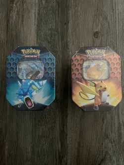 New/Sealed - Set of 2 Pokemon Hidden Fates GX Tins - Gyarados and Raichu - Image 1