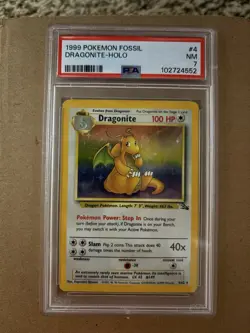 1999 Pokemon TCG Dragonite Fossil Holo Card 4/62 PSA 7 - Image 1